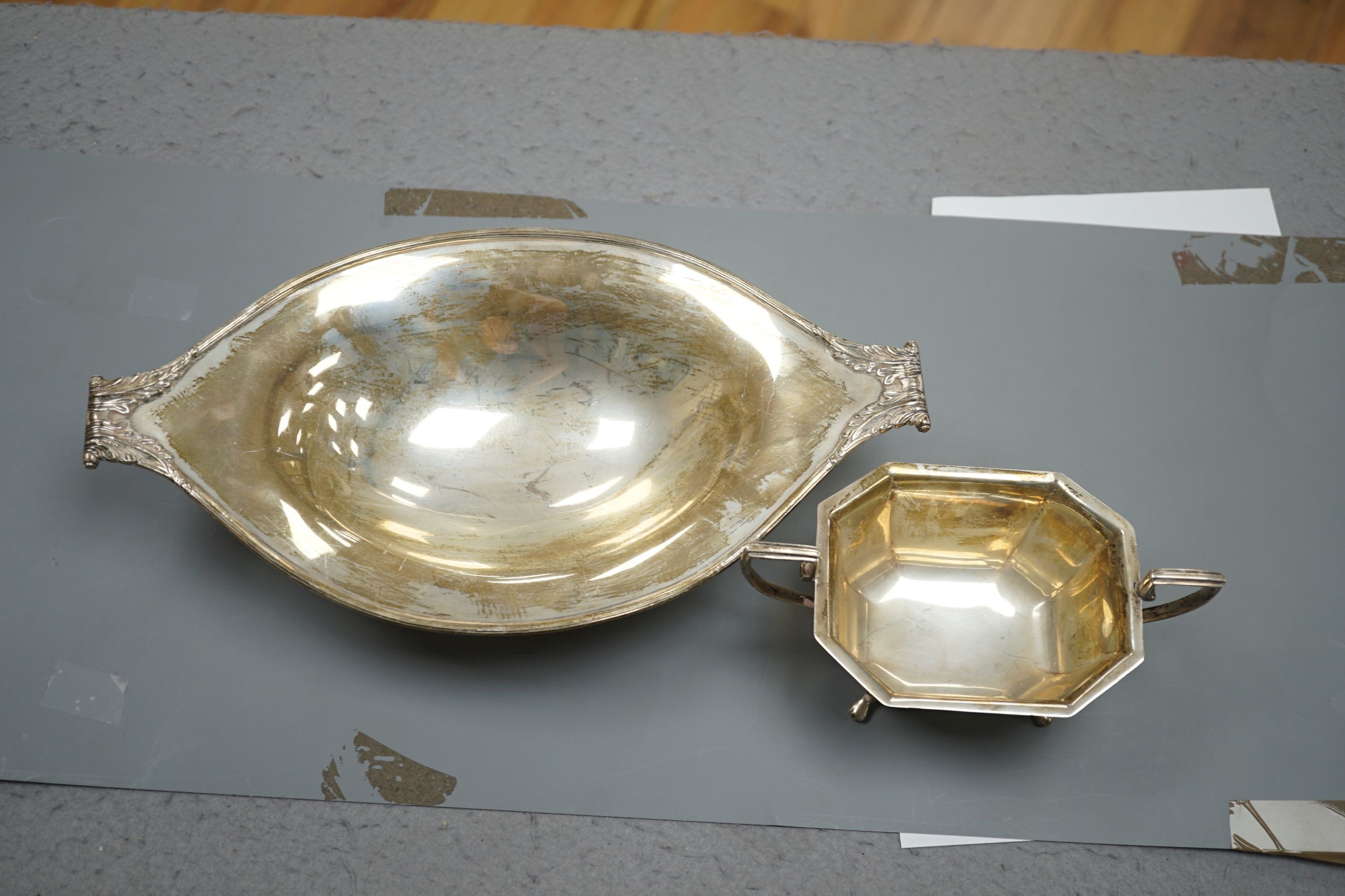 An Edwardian silver two handled fruit bowl, R & S Sorley, London, 1908, 31.9cm and a later two handled sugar bowl, 20.5oz.